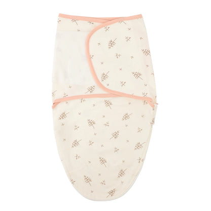 Beige Leaf pattern newborn swaddle sleep sack made of 100% cotton, featuring adjustable silent velcro wings with peach trim.
