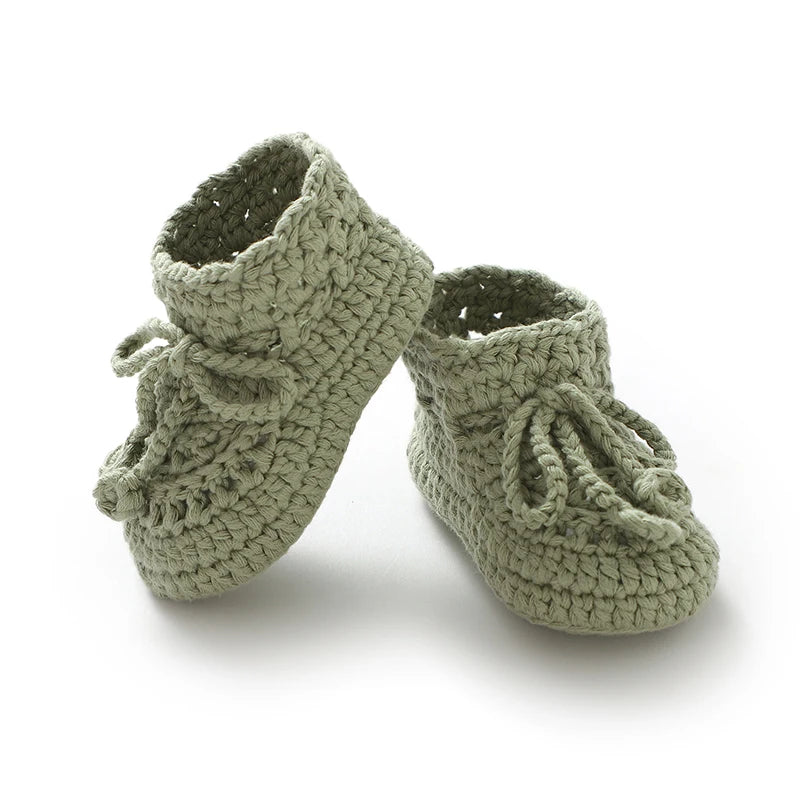 Vintage inspired knit baby booties in moccasin style with ankle ties, anti-slip soft sole for infants 0-12 months.