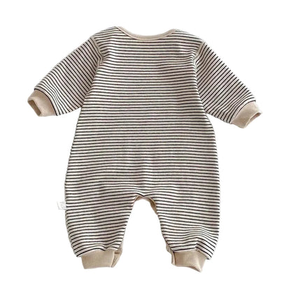 Back view of the long-sleeve neutral striped baby romper in Oat & Onyx.