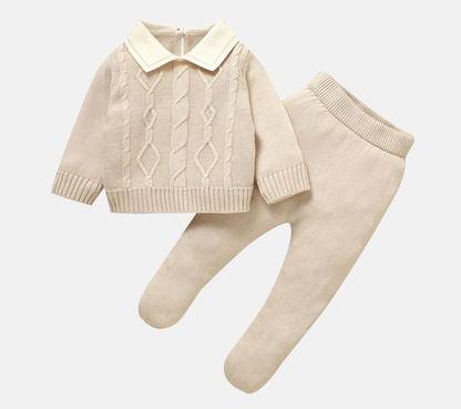 2-piece newborn boy cable knit sweater and footed pants set in soft beige.
