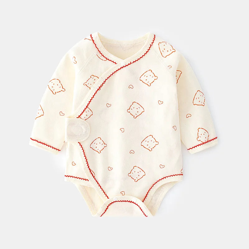 Long sleeve baby bodysuit featuring a cute line-art pattern of bears and toast slices with red contrast piping.