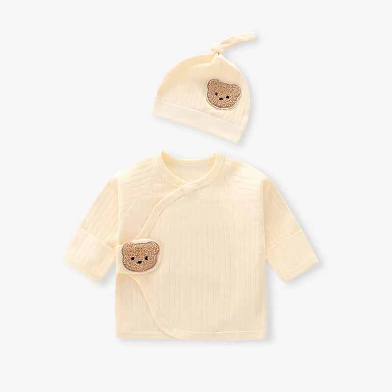 Soft yellow baby side-snap wrap shirt and beanie set made of ribbed cotton with a cute bear design.