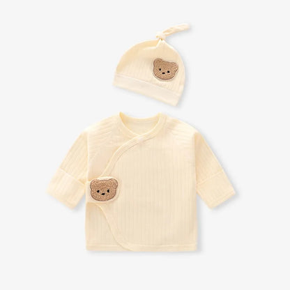 Soft yellow baby side-snap wrap shirt and beanie set made of ribbed cotton with a cute bear design.