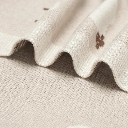 Macro shot of the breathable 100% cotton knit in Oatmeal, highlighting the high-quality stitching and anti-pilling finish.