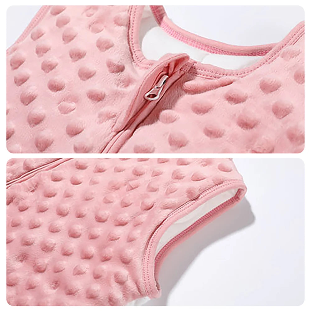 Close-up of pink minky dot sensory texture on baby sleep sack, featuring a safety zipper guard to protect baby's chin and high-quality armhole stitching.
