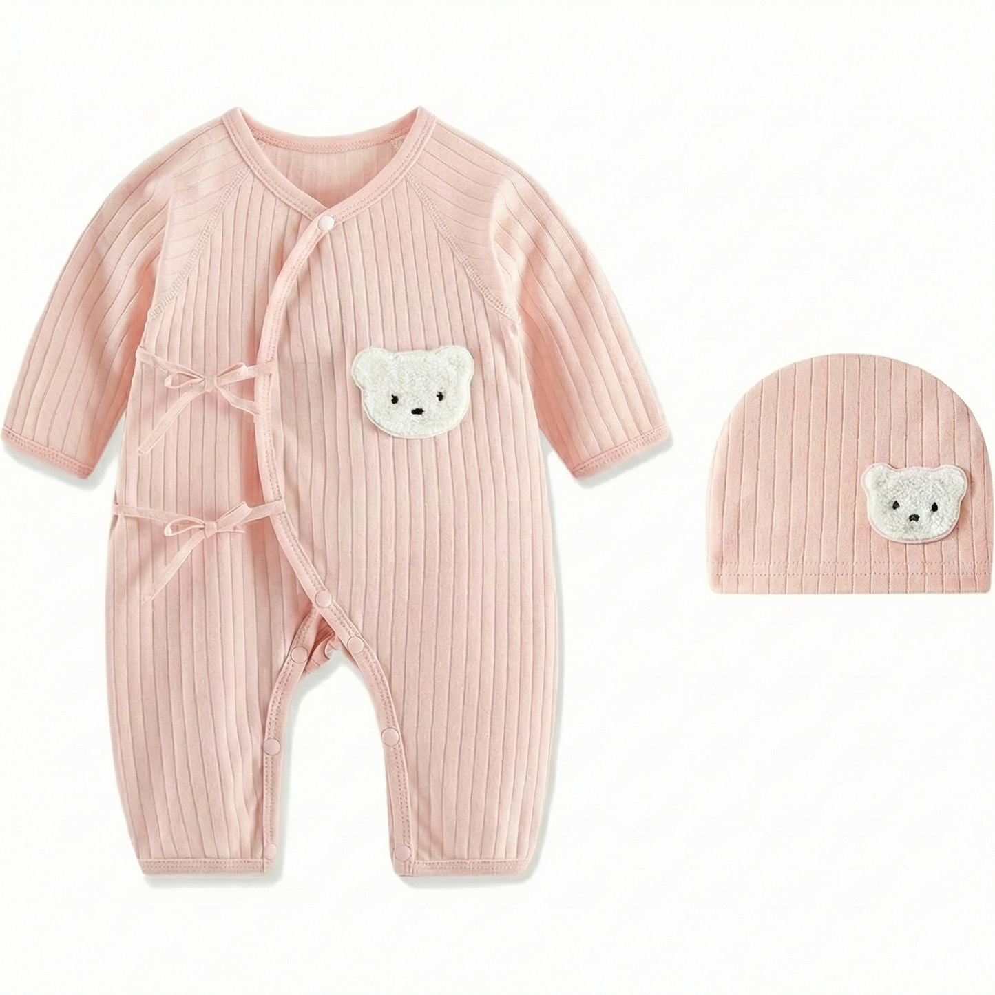 Pink ribbed cotton baby girl romper with side-tie kimono closure and matching hat featuring a cute white bear patch.