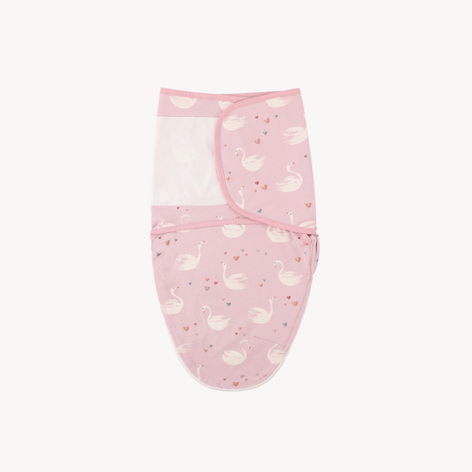 pink swan print cotton swaddle sleep sack with secure velcro wrap.