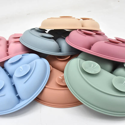Set of colorful silicone plates on a white background