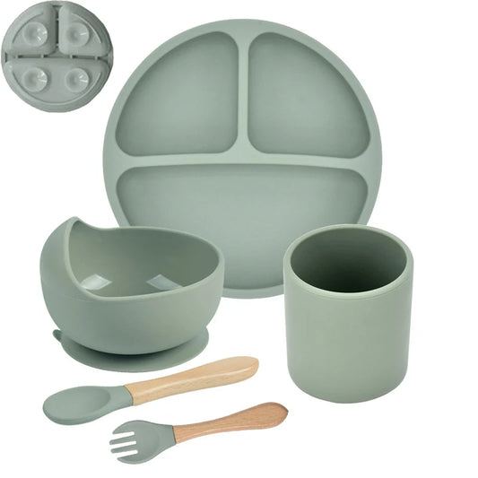 Children's dining set with plate, bowl, cup, spoon, and fork on a white background