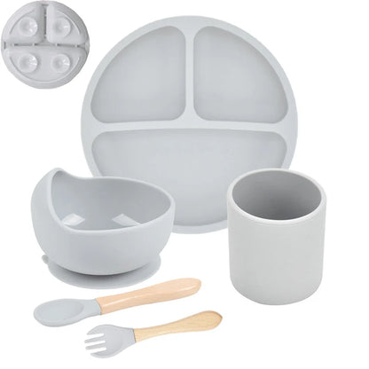 Gray children's dining set with plate, bowl, cup, and utensils on a white background
