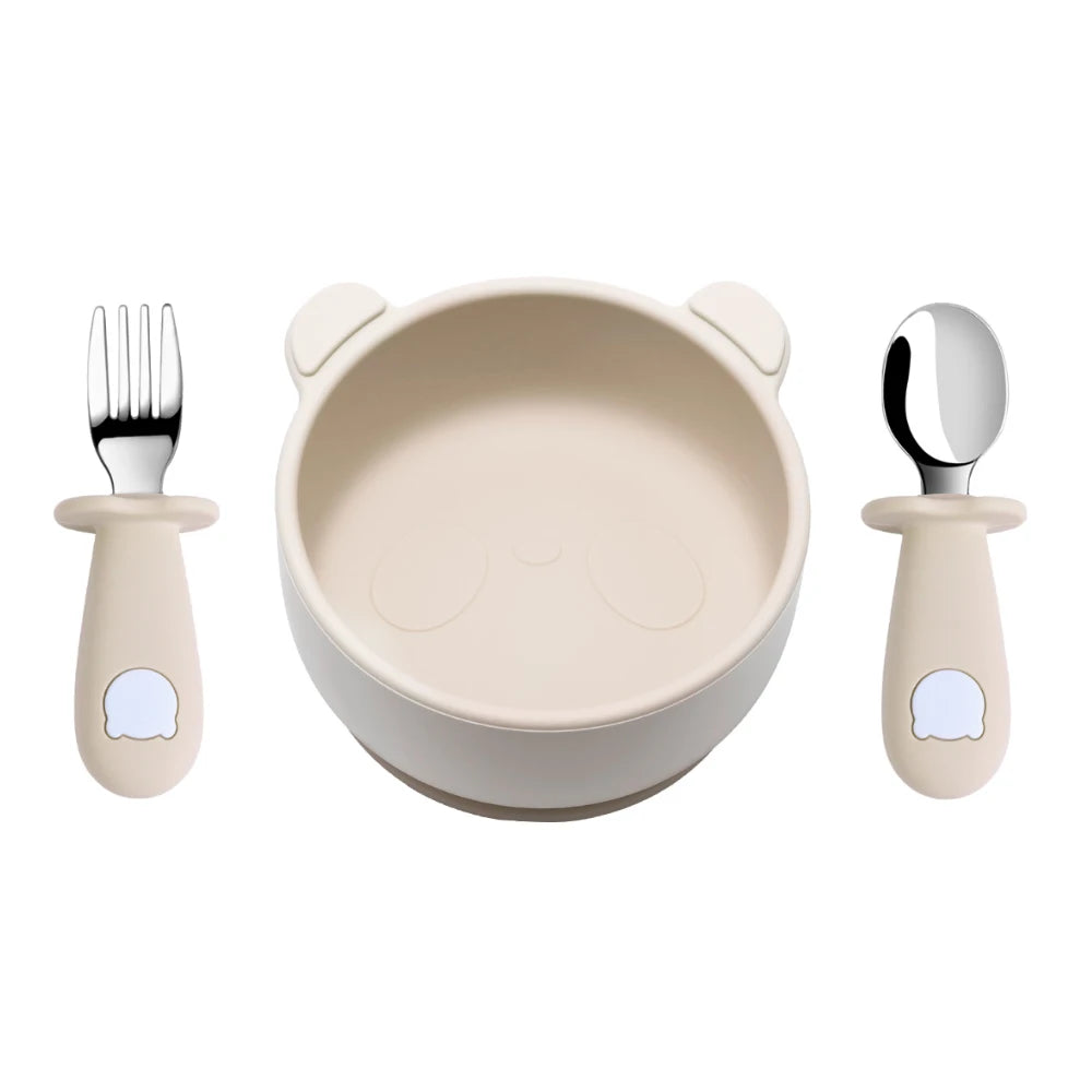 Children's dining set with bowl, fork, and spoon on a white background