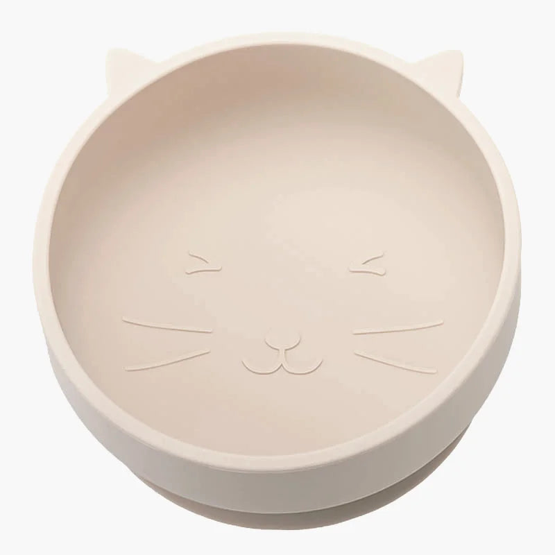 Beige cat-shaped bowl with embossed face on a white background