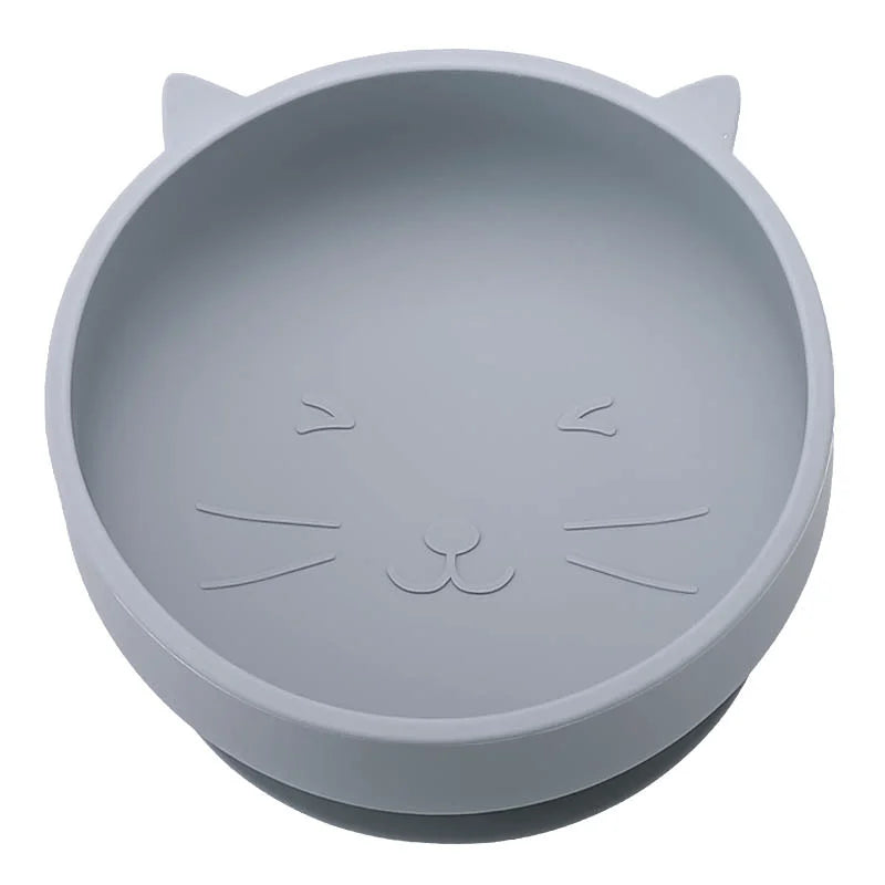 Gray silicone bowl with cat face design on a white background