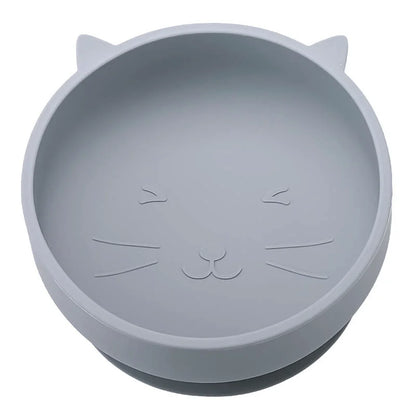 Gray silicone bowl with cat face design on a white background