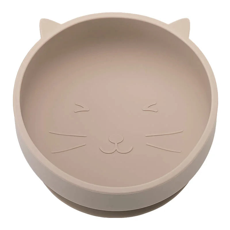 Khaki cat-shaped bowl with embossed features on a white background