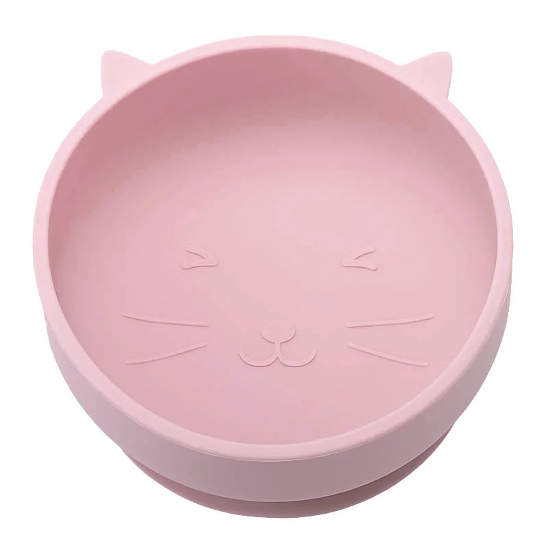 Pink bowl shaped like a cat's face on a white background