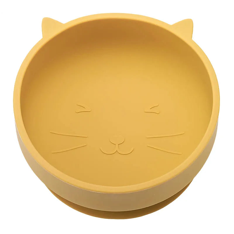 Yellow cat-shaped bowl on a white background