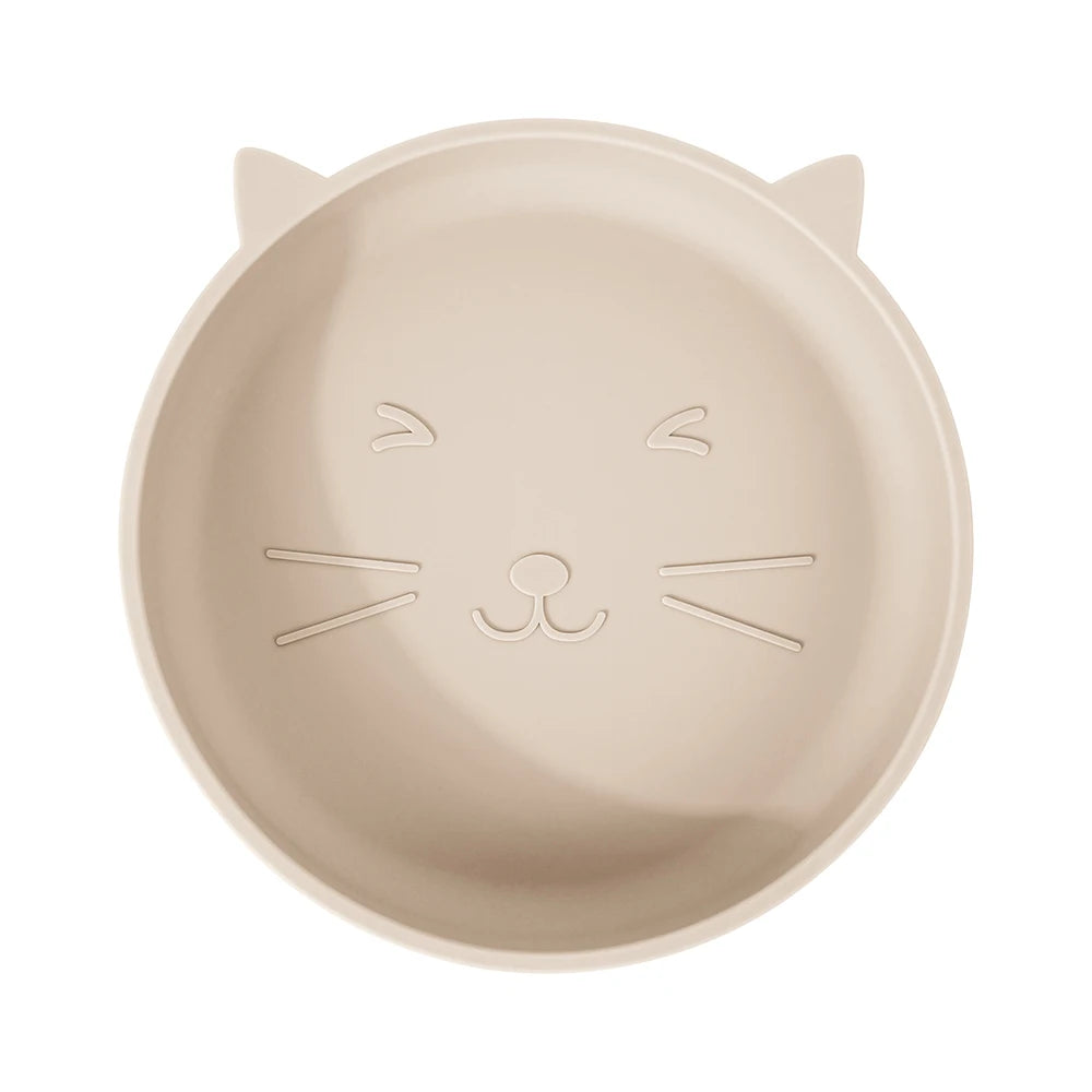 Beige plate shaped like a cat's face on a white background