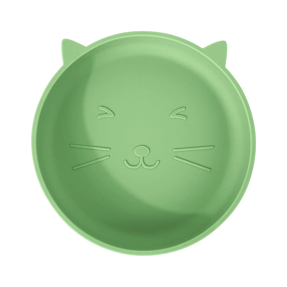 Green cat-shaped plate on a white background