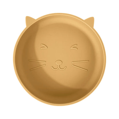 Gold-colored plate shaped like a cat's face on a white background