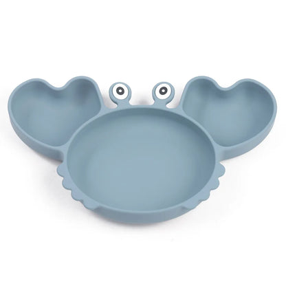 Blue silicone crab-shaped plate on a white background