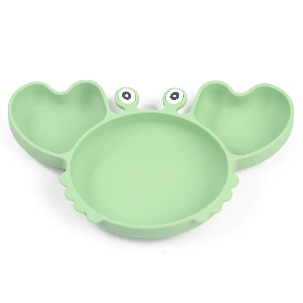 Green crab-shaped plate on a white background