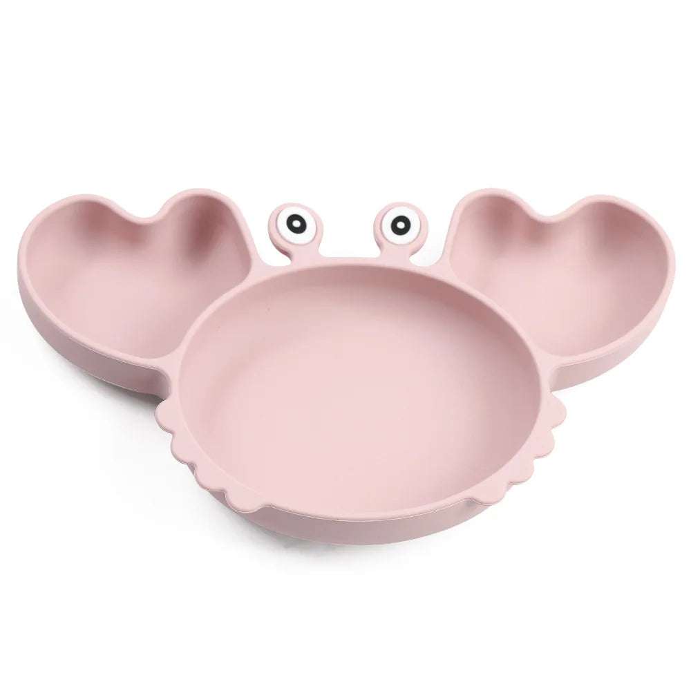 Pink children's plate shaped like a crab on a white background