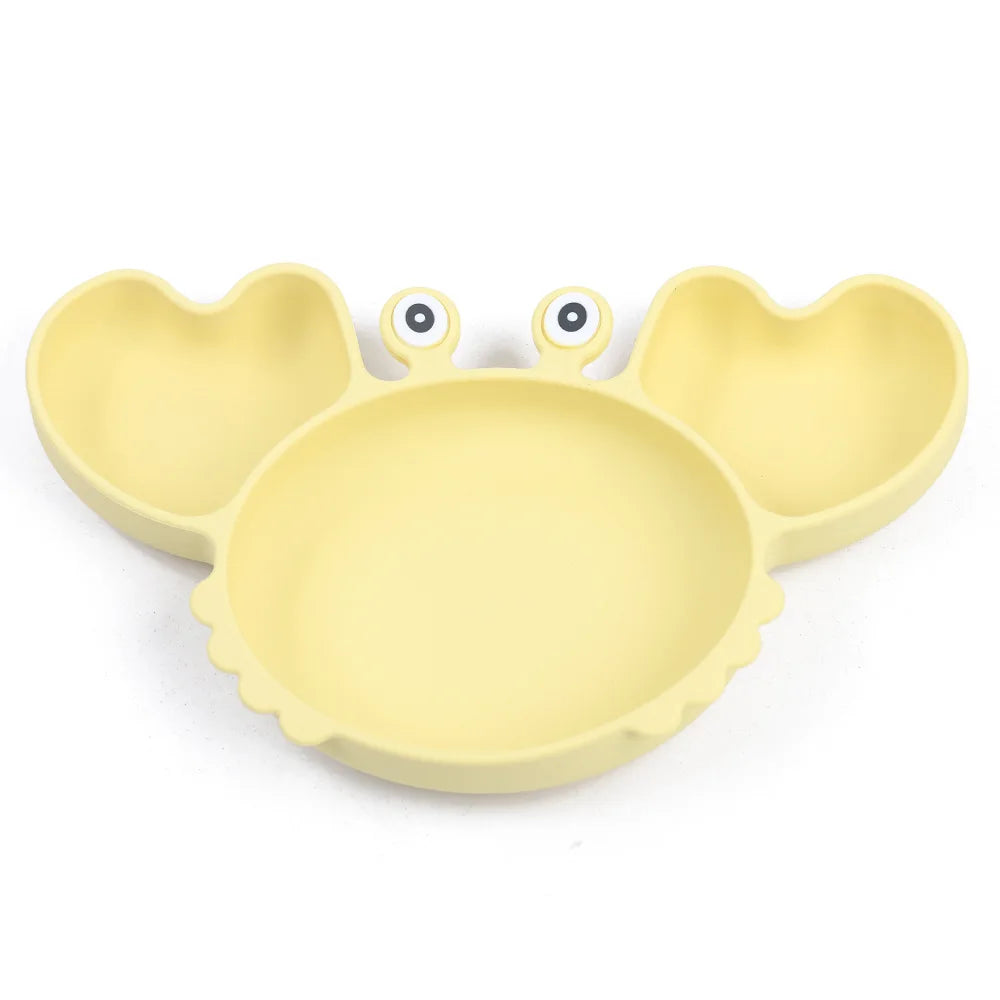 Yellow crab-shaped plate on a white background