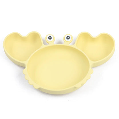 Yellow crab-shaped plate on a white background