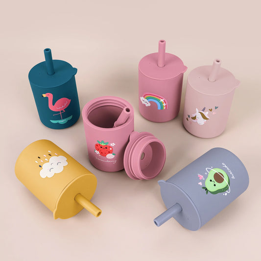 Small silicone baby training cup with lid and straw, shown on a plain background.