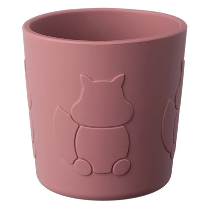 Pink cup with squirrel design on a white background