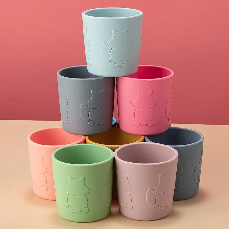 Silicone toddler cup featuring a cute squirrel design on the front, with a secure lid and straw.