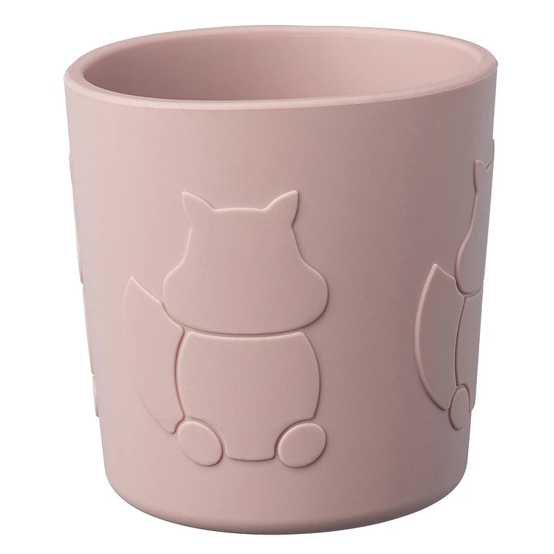 Pink cup with squirrel design on a white background