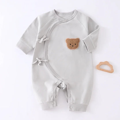 Grey long sleeve baby sleepsuit with side snaps and matching bear patch hat, cozy polyester newborn outfit.