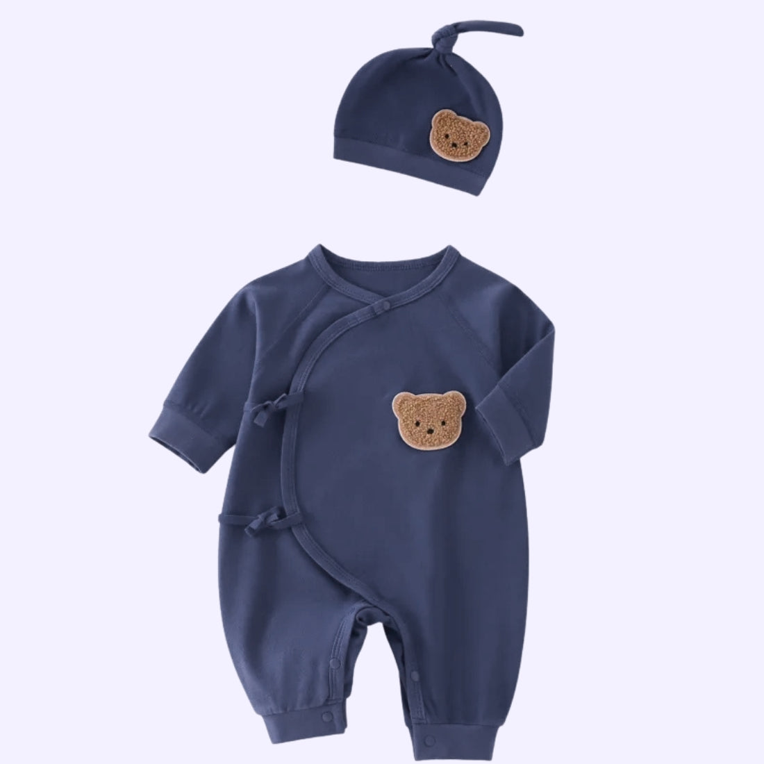 Navy blue infant wrap-style onesie with matching hat, featuring teddy bear embroidery for baby boy coming home outfit.
