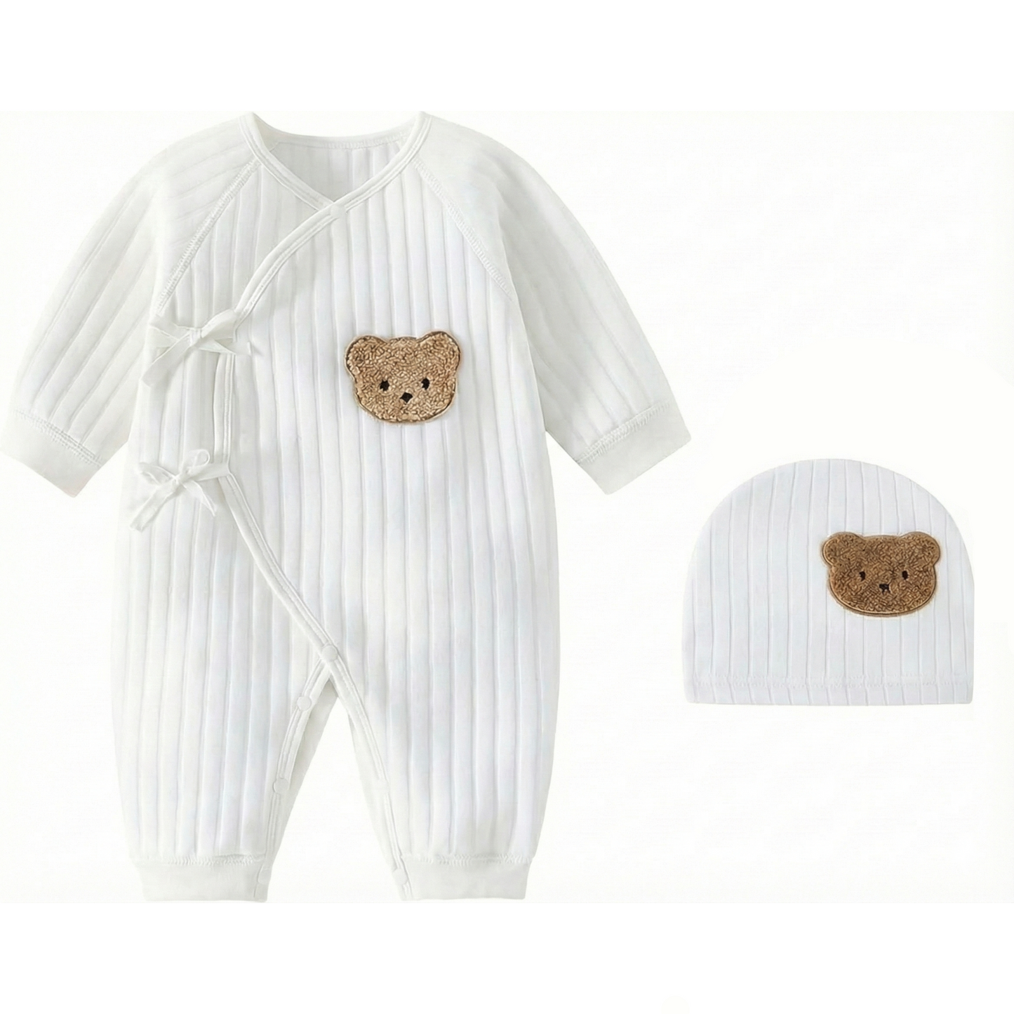 White side-snap baby kimono bodysuit made of soft ribbed cotton with a brown bear patch and matching hat.