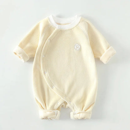 Yellow unisex waffle knit baby sleeper with side snaps for newborn boys and girls.